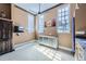 Bonus room with a ceiling fan, lots of natural light and a metal storage unit at 2971 Fall River Rd, Idaho Springs, CO 80452