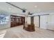 Spacious office with wood floors, custom desk, built-in bookshelves, closet and window with natural light at 2971 Fall River Rd, Idaho Springs, CO 80452
