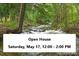 Scenic view of creek through property with Open House banner at 2971 Fall River Rd, Idaho Springs, CO 80452