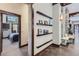 Hallway with wooden trim, built-in shelving, and a fireplace at 2971 Fall River Rd, Idaho Springs, CO 80452