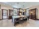 Bright kitchen featuring a large island, barstool seating and wood cabinets at 2971 Fall River Rd, Idaho Springs, CO 80452