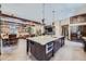 Gourmet kitchen with island, dining area, and living space at 2971 Fall River Rd, Idaho Springs, CO 80452