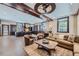Open concept living space features a cozy seating area and kitchen with breakfast bar for modern living at 2971 Fall River Rd, Idaho Springs, CO 80452