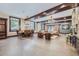 Open-concept living area with dining table, living room seating, and fireplace at 2971 Fall River Rd, Idaho Springs, CO 80452