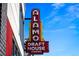 Vintage Alamo Draft House Cinema sign with classic neon lettering against a bright blue sky at 3480 W 14Th Ave, Denver, CO 80204