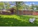 Lush backyard featuring a covered patio and spacious deck, perfect for outdoor living and entertaining at 1040 Zang St, Golden, CO 80401