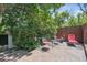 Charming backyard patio with stone pavers, cozy seating, and lush greenery creates a serene outdoor escape at 1040 Zang St, Golden, CO 80401
