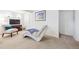 Cozy basement with plush carpeting and a stylish chaise lounge at 1040 Zang St, Golden, CO 80401