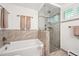 Modern bathroom featuring a soaking tub and a glass-enclosed shower at 1040 Zang St, Golden, CO 80401