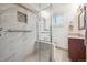 Modern bathroom boasts a glass-enclosed shower, complemented by updated fixtures and design elements at 1040 Zang St, Golden, CO 80401