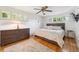 Relaxing bedroom with ample natural light, hardwood floors, and a ceiling fan at 1040 Zang St, Golden, CO 80401