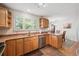 Bright kitchen featuring stainless steel appliances and a window overlooking the backyard at 1040 Zang St, Golden, CO 80401