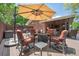 Inviting backyard patio with a fire pit and comfortable seating, perfect for outdoor gatherings at 1040 Zang St, Golden, CO 80401