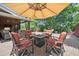 Backyard patio with a fire pit and comfortable seating, perfect for outdoor gatherings and relaxation at 1040 Zang St, Golden, CO 80401