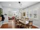 Stylish dining room offering an open layout with hardwood floors and a modern light fixture at 583 S York St, Denver, CO 80209