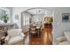 Spacious dining room with an arched doorway, hardwood floors, and modern lighting fixtures at 583 S York St, Denver, CO 80209