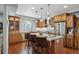 Gourmet kitchen featuring stainless steel appliances, granite countertops, and custom cabinetry at 583 S York St, Denver, CO 80209