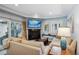Inviting living room with fireplace, tv, comfortable seating, and access to the outdoor patio at 583 S York St, Denver, CO 80209