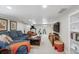 Finished basement with sectional sofa and workout area, perfect for entertaining and fitness at 583 S York St, Denver, CO 80209