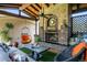 Inviting outdoor living space featuring a brick fireplace, comfortable seating, and stylish decor for relaxation and entertaining at 583 S York St, Denver, CO 80209