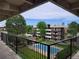 Exterior view from walkway showing common green area and pool at 384 S Ironton St # 407, Aurora, CO 80012