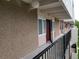 Exterior view from walkway showing the open door to the building at 384 S Ironton St # 407, Aurora, CO 80012