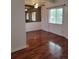 A bright living room featuring hardwood floors and a ceiling fan at 384 S Ironton St # 407, Aurora, CO 80012