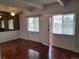 A bright living room featuring hardwood floors and two windows at 384 S Ironton St # 407, Aurora, CO 80012