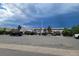 Street view of the parking lot and the apartment building featuring landscaped areas at 384 S Ironton St # 407, Aurora, CO 80012