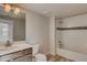 Bright bathroom featuring a tub and a modern vanity with elegant fixtures at 862 W 129Th Pl, Westminster, CO 80234