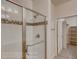 Modern bathroom featuring a glass-enclosed shower with tile surround and bronze fixtures at 862 W 129Th Pl, Westminster, CO 80234