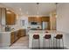 Modern kitchen featuring stainless steel appliances, granite countertops, and a breakfast bar with seating at 862 W 129Th Pl, Westminster, CO 80234