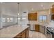 Well-lit kitchen offers stainless appliances, countertop space and convenient breakfast bar at 862 W 129Th Pl, Westminster, CO 80234