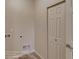 Bright laundry room features updated flooring, utility sink, and washer-dryer hookups, offering convenience and functionality at 862 W 129Th Pl, Westminster, CO 80234