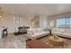 Bright living room and dining area featuring hardwood floors, comfortable seating, and abundant natural light at 862 W 129Th Pl, Westminster, CO 80234