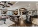 Expansive basement game room with pool table, shuffleboard, stone fireplace, and bar area at 1820 Mallard Dr, Broomfield, CO 80020
