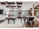 Basement game area featuring a pool table, shuffleboard, fireplace, and entertainment space at 1820 Mallard Dr, Broomfield, CO 80020