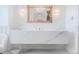 A modern bathroom boasts a floating vanity, statement mirror, and stylish lighting fixtures at 1820 Mallard Dr, Broomfield, CO 80020