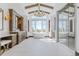 A spacious bathroom features a soaking tub under a large window, elegant fixtures, and a glass enclosed shower at 1820 Mallard Dr, Broomfield, CO 80020