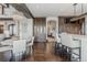 Open concept dining area featuring a long bar and a built-in dark-wood display cabinet at 1820 Mallard Dr, Broomfield, CO 80020
