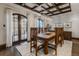 Formal dining room boasts hardwood floors, a coffered ceiling, and French doors to the patio at 1820 Mallard Dr, Broomfield, CO 80020
