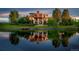 Stunning lakefront home with a lush green lawn and a tranquil water reflection showcasing its beauty at 1820 Mallard Dr, Broomfield, CO 80020