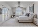 Serene main bedroom suite with scenic views from the windows and glass patio doors at 1820 Mallard Dr, Broomfield, CO 80020