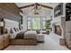 Spacious main bedroom featuring high ceilings, a fireplace, and a large window with tree views at 1820 Mallard Dr, Broomfield, CO 80020
