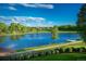 Scenic view of community pond, lush green spaces, mature trees, and a tranquil atmosphere at 1820 Mallard Dr, Broomfield, CO 80020