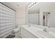Bathroom featuring double sinks and a shower/tub combo with neutral color at 7638 S Hudson Way, Centennial, CO 80122