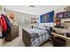 Bedroom with hardwood bed frame, dresser, shelves, and large window at 7638 S Hudson Way, Centennial, CO 80122