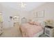 Bedroom with a view to the en-suite bathroom through an arched entrance at 7638 S Hudson Way, Centennial, CO 80122