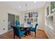 Dining room with a round table, four chairs, and a sliding glass door at 7638 S Hudson Way, Centennial, CO 80122