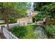 Lovely two-story home with a lush front yard, mature trees, a three car garage, and inviting curb appeal at 7638 S Hudson Way, Centennial, CO 80122